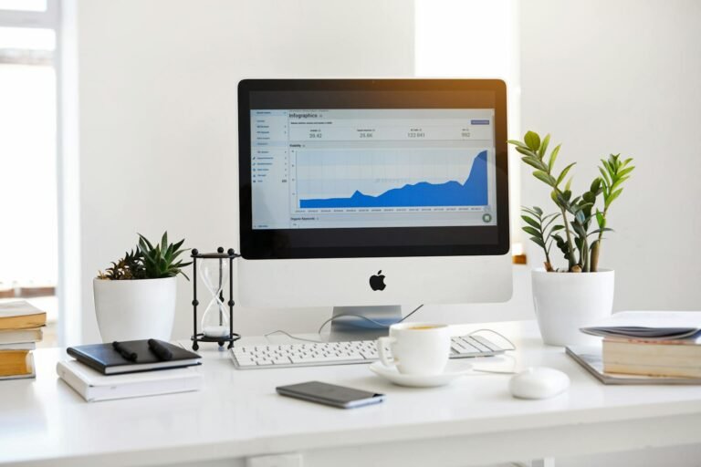 auditoría de marketing digital, A clean, contemporary workspace featuring a desktop with analytics on the screen and plants for a fresh look.